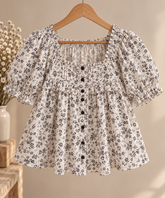 Blusa de algodón floral blanco y negro Blusa de algodón abullonada floral blanco y negro delantero 