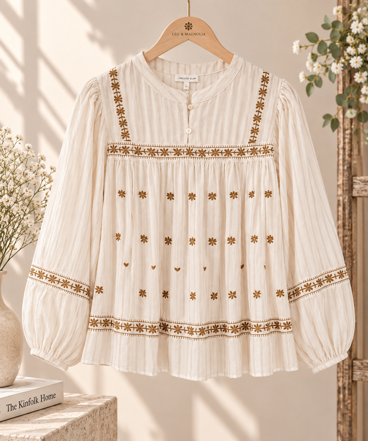 Blusa bordada de gasa de algodón marfil con manga abullonada 